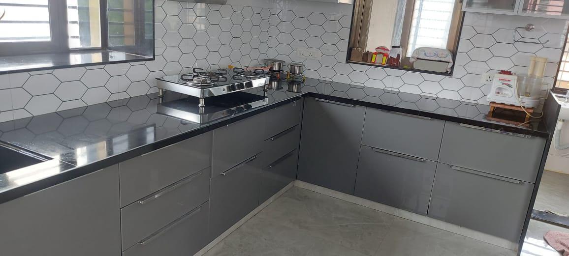 The sleek modular kitchen which features hydraulic trolleys. (Source: CKA Archives)