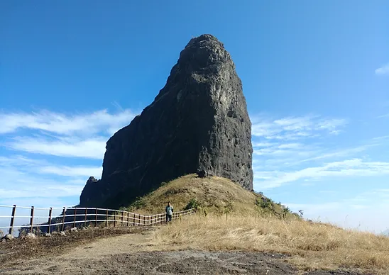 Dhodap Fort, located near Chandwad in Nashik district, features rock-cut chambers, twin gateways, and a summit mazar, all perched nearly 5,000 ft. high.[3]