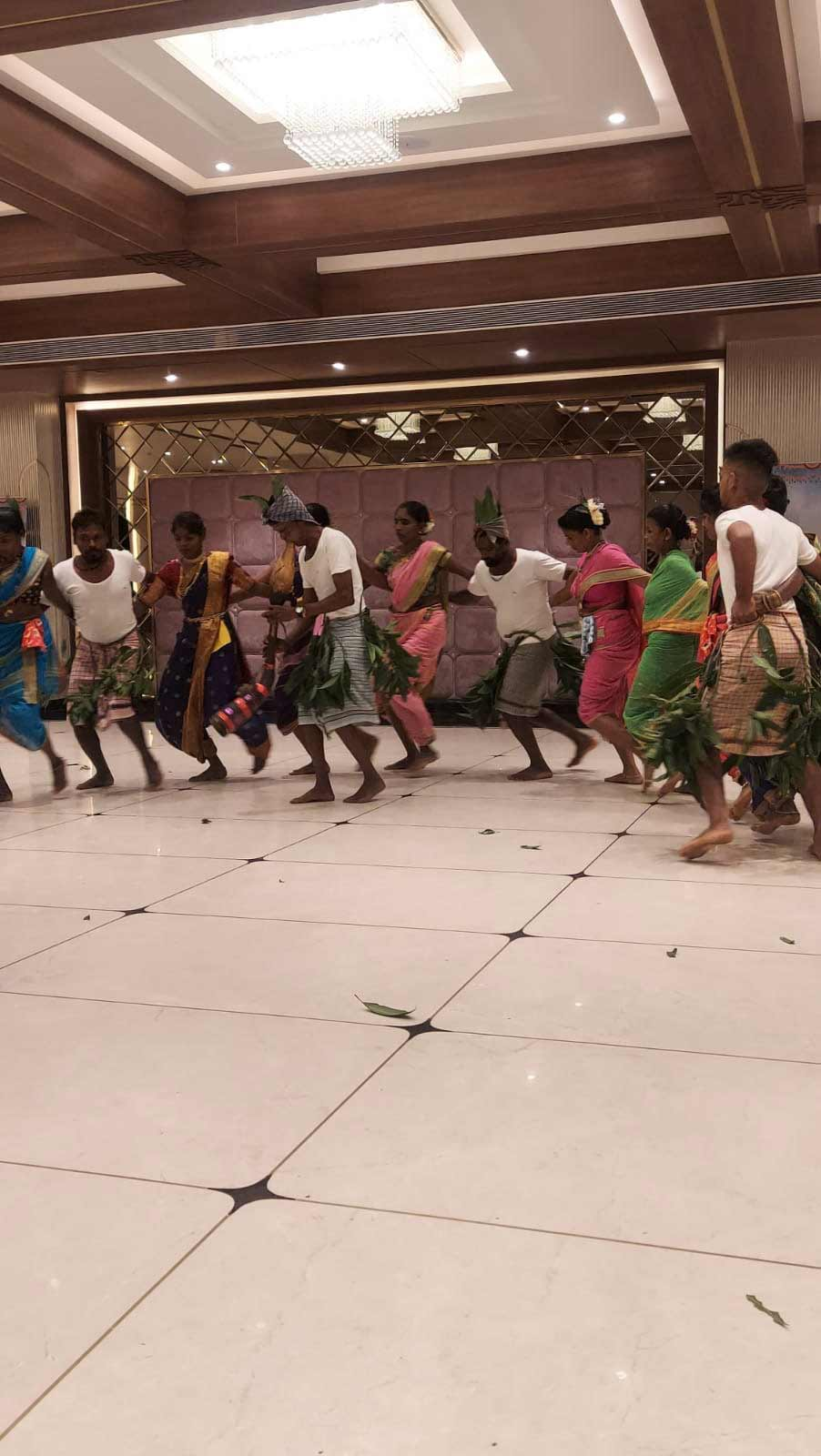 Participants perform Tarpa dance during an event.[2]