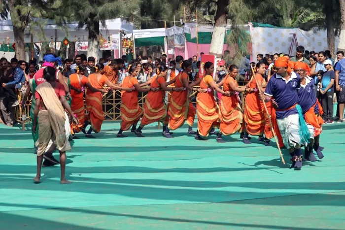 Folk dancers perform at the Chikoo Festival, showcasing traditional rhythms and movements from the Konkan region.[2]