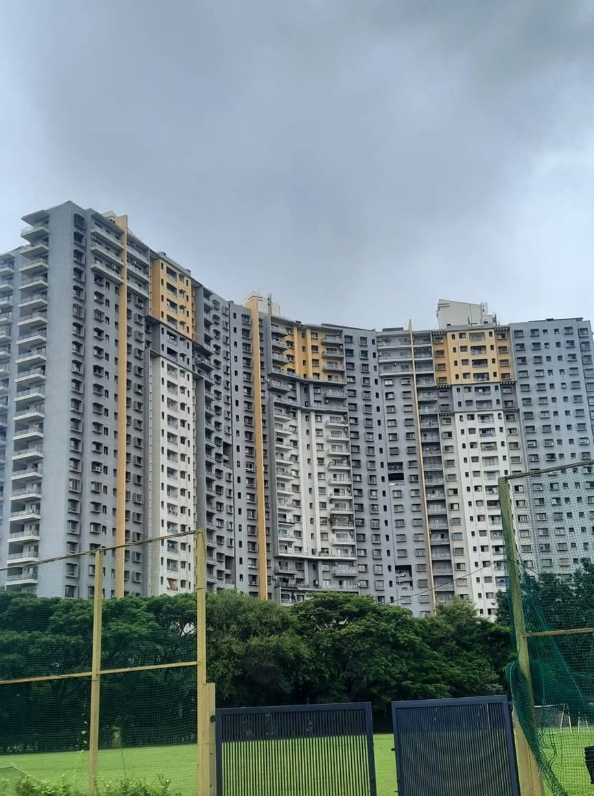 Residential buildings with a neutral color palette of grey and white with pops of yellow color. (Source: CKA Archives)