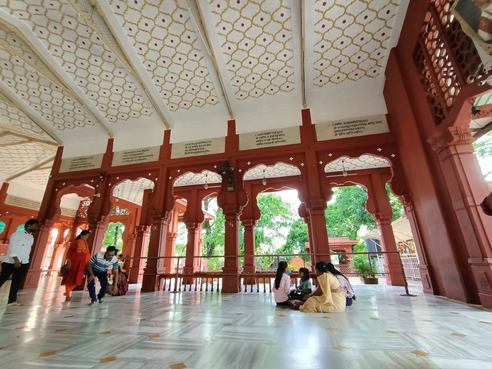 Marble flooring and white-gold carvings on the inner ceiling of the Mandir. (Source: CKA Archives)