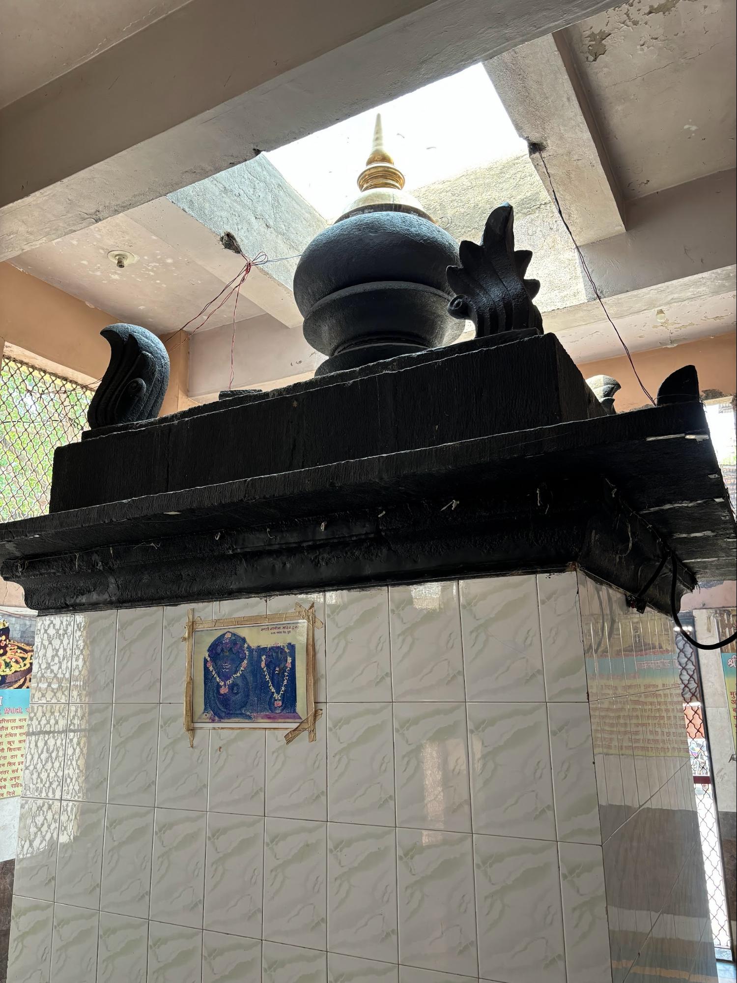 Rear view of the Mandir showing its black stone structure and the golden kalasha, an ornamental finial placed at the top of the shikhara. (Source: CKA Archives)