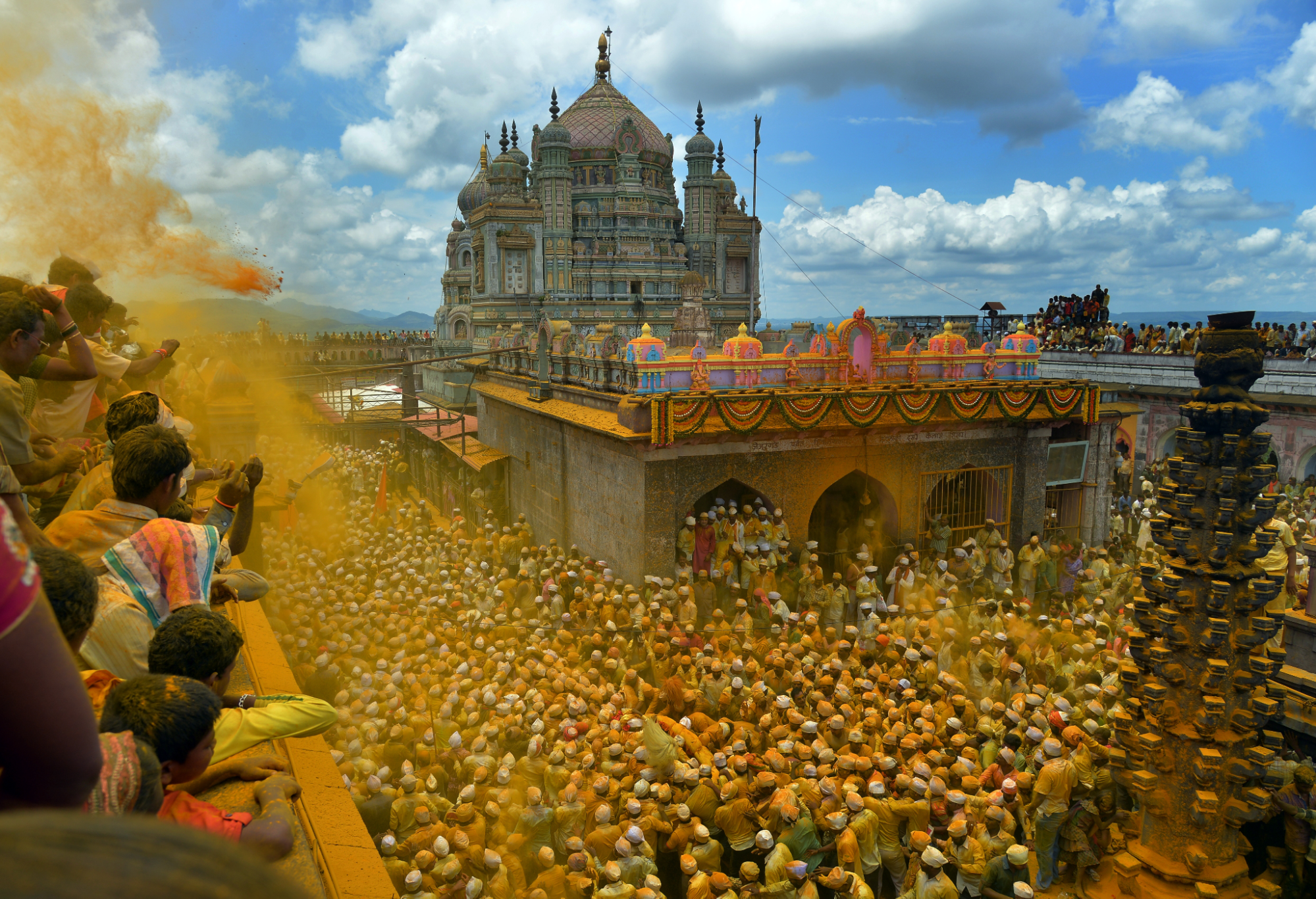 Yatris gathered around the turmeric-covered Shri Khandoba Mandir, Jejuri, Pune district which is a major religious and cultural site in Maharashtra.[81]