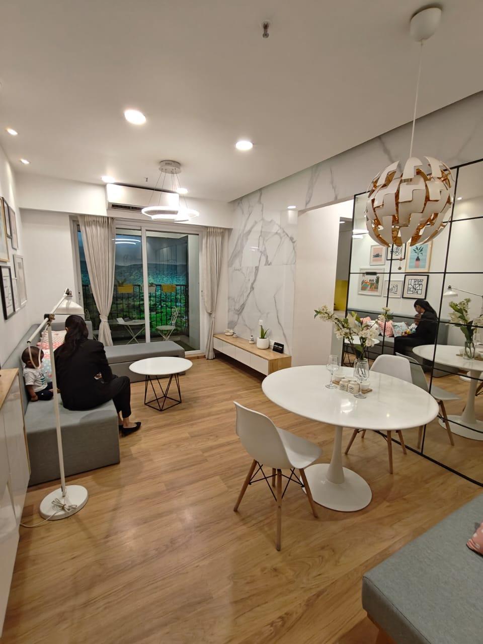 Furnished living room featuring a wooden floor and contemporary interiors. (Source: CKA Archives)