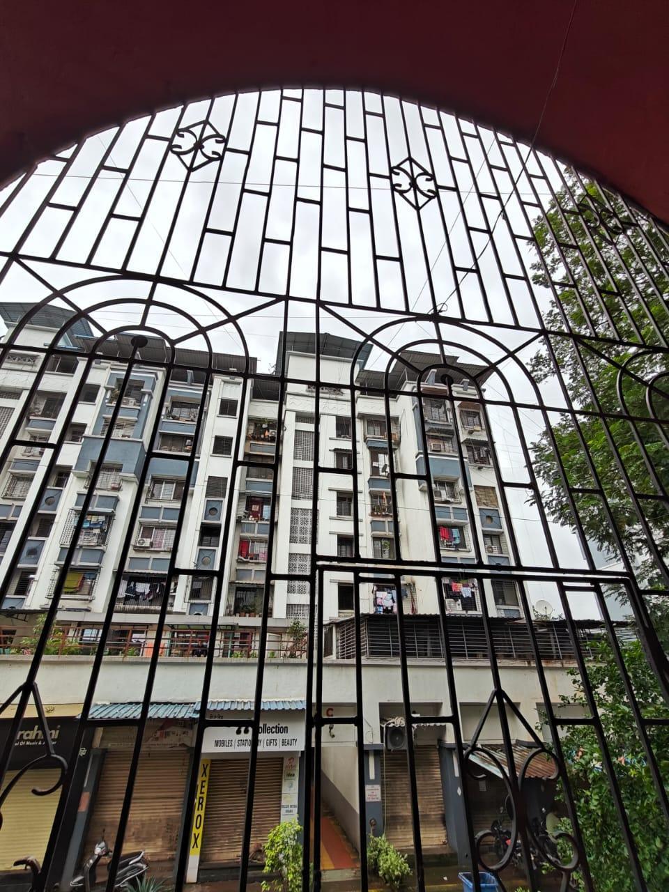 The first-floor balcony sits within a curved arch frame and has metal barriers. This shows how safety features can also be made attractive and match the overall style of the building. (Source: CKA Archives)