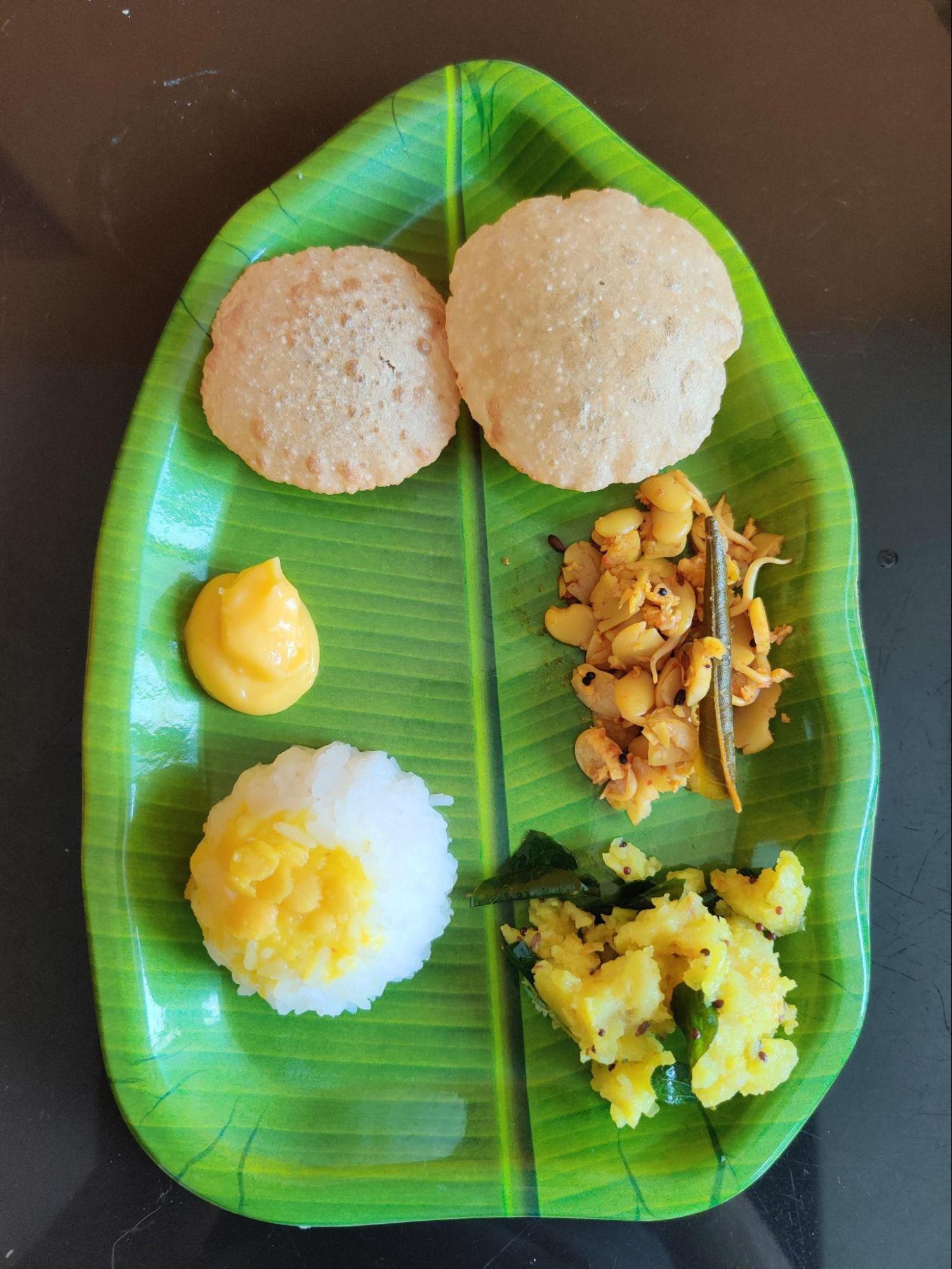 Traditional Gudi Padwa meal which includes Puri, Batatyachi Bhaaji, Valach Birda, Varan Bhaat, and Shrikhanda. (Source: CKA Archives)