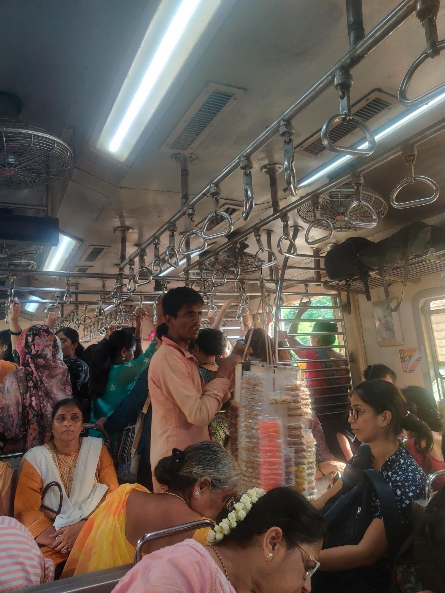 A vendor selling items inside a Mumbai local train—offering convenience to long-distance commuters from Raigad. (Source: CKA Archives)