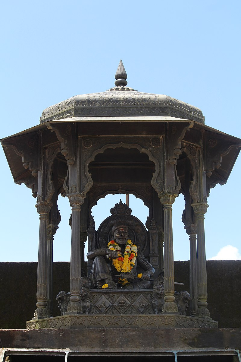 Sculpture of Shivaji Maharaj seated on his throne, commemorating his coronation at Raigad Fort. The installation represents a pivotal moment in Maratha history.