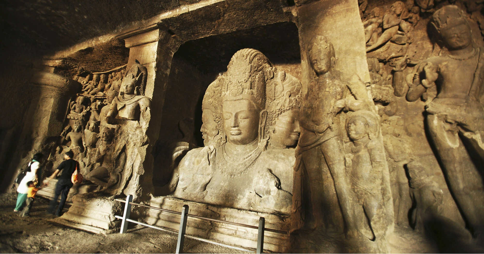 The caves of Gharapuri, Raigad district are adorned with numerous carvings of Shiva. A distinctive feature of these caves is that they were carved from a single rock, starting from the top and working downwards. Among the many attractions is the impressive statue of Brahma-Vishnu-Mahesh. (Source: CKA Archives)
