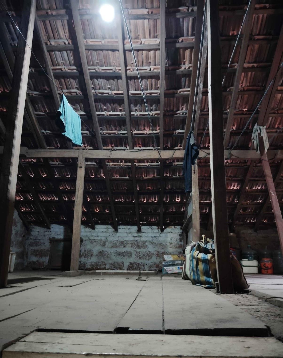 Attic with a wooden floor and visible roof rafters. (Source: CKA Archives)