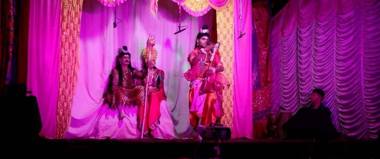 A Naman performance in Pirlote village, Ratnagiri, where the audience gathers around a raised stage as costumed performers enact sacred stories. (Source: CKA Archives)
