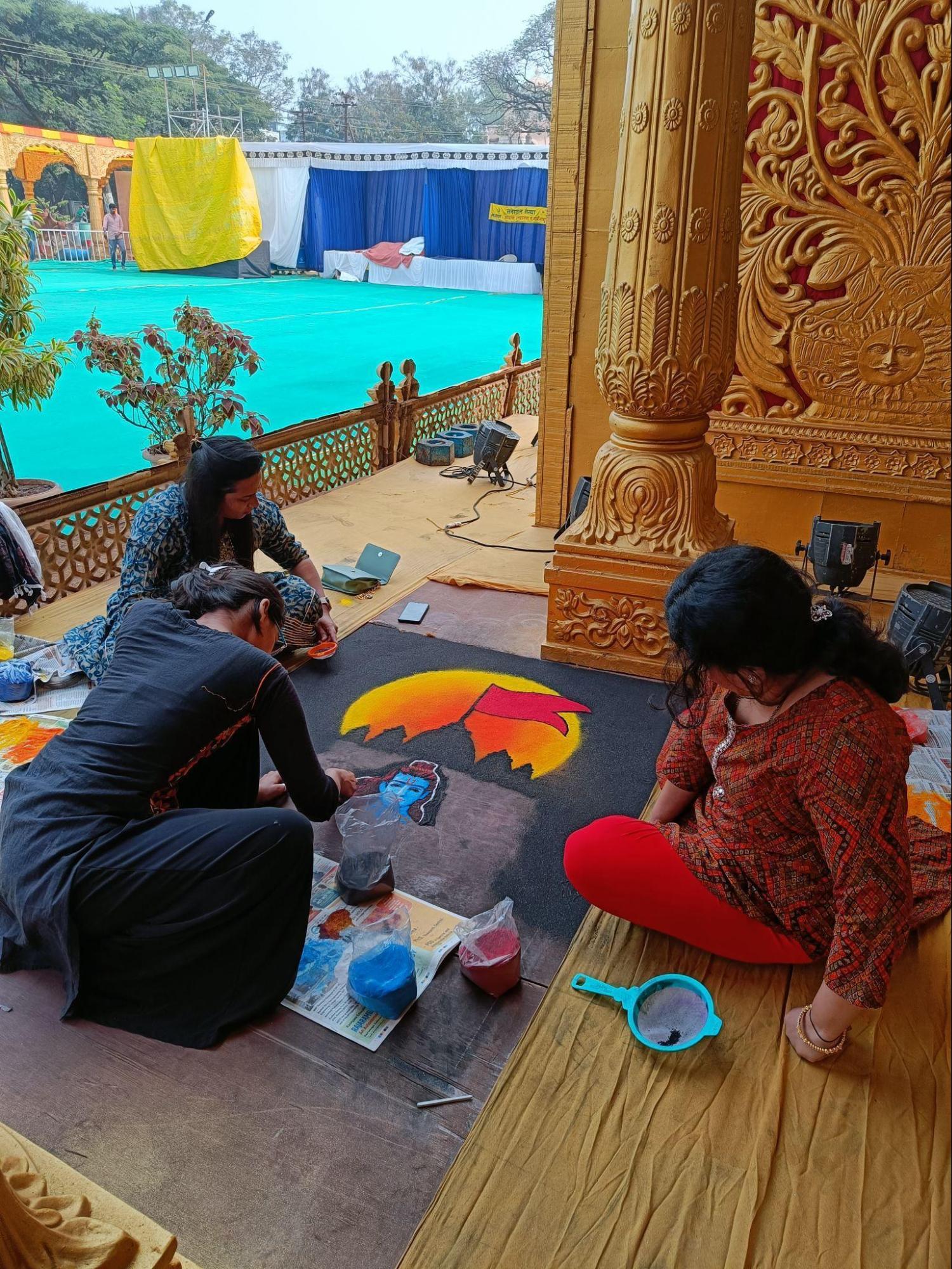 A group of women skillfully draw a beautiful rangoli of Bhagwan Ram at the Ayodhya Nagari Festival held in Sangli at the Neeminath Nagar ground. (Source: CKA Archives)