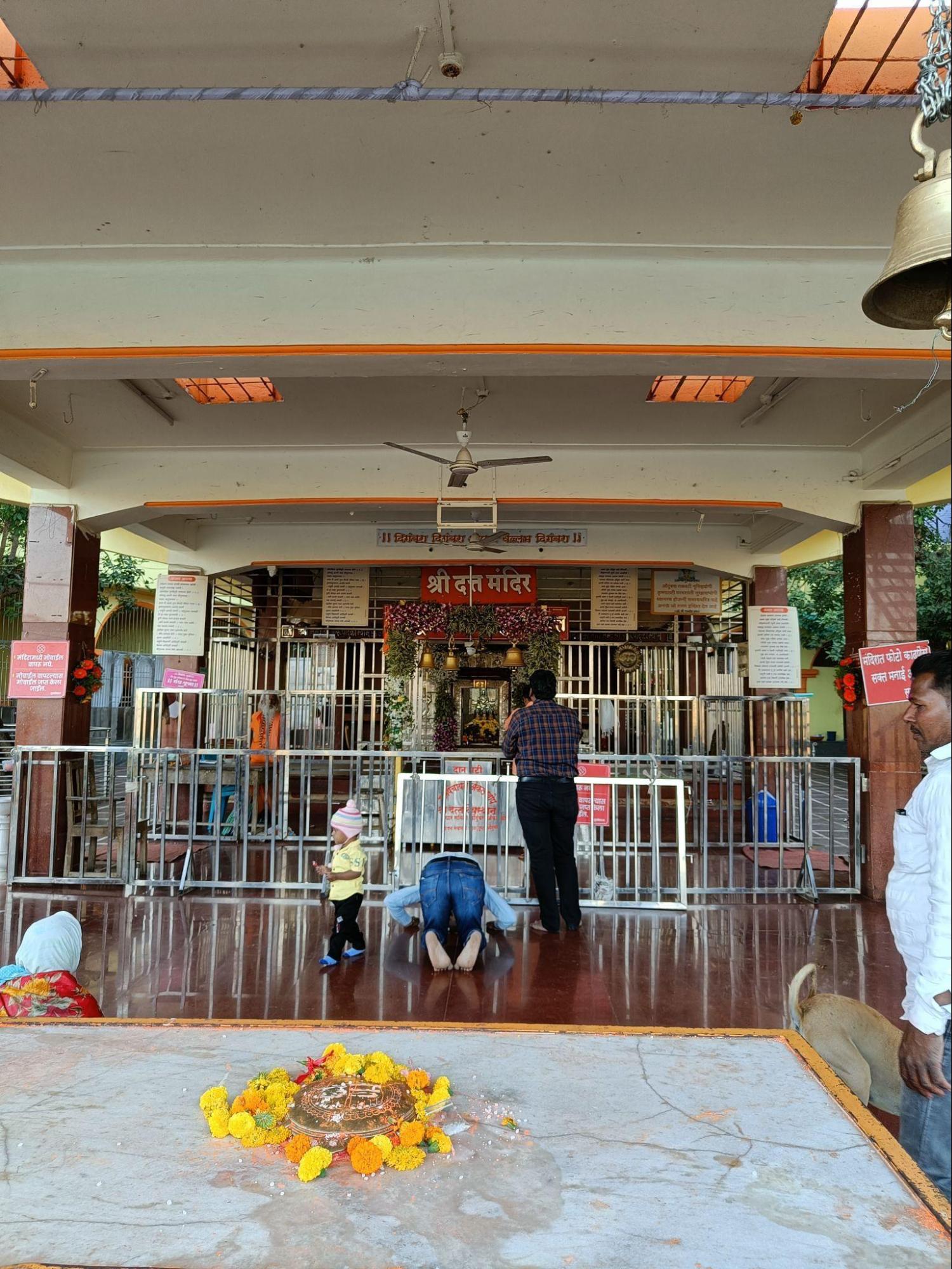 A bhakt touches his head to the ground to seek blessings of Adi Dattatraya.(Source: CKA Archives)