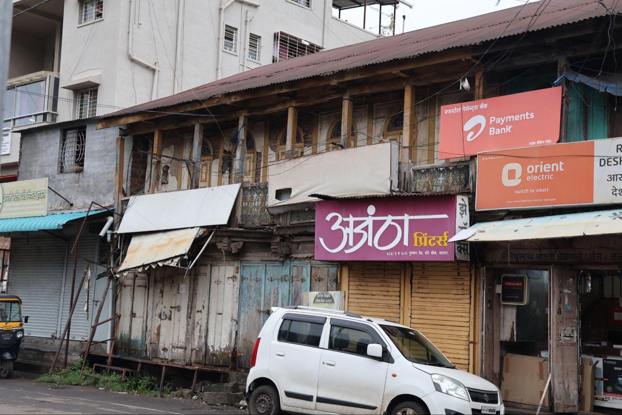 A wider view of a ground floor shop front which has a distinct design language that distinguishes it from the upper floors of the Wada.(Source: CKA Archives)