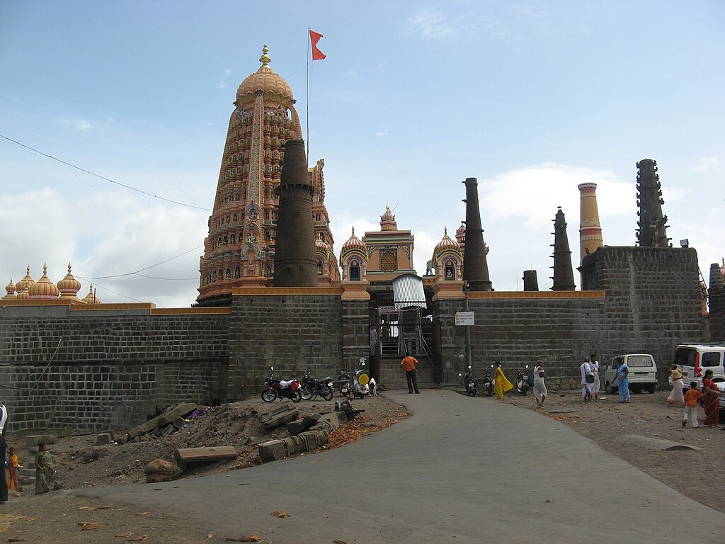Shambhu Mahadev Mandir, Shikhar Shingnapur—stone-built Mandir with carved spire, housing twin Shivlings representing Shiv and Parvati.[3]