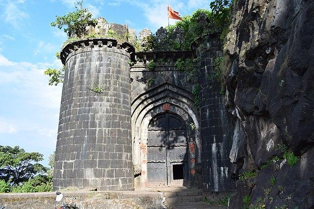 The fortified main gateway of Ajinkyatara Fort, built with high buttresses for protection.