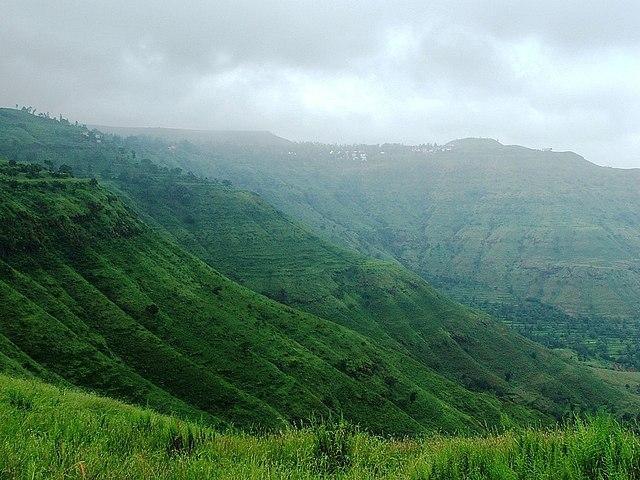 View of the lush green Panchgani hills during the peak monsoon season in July.