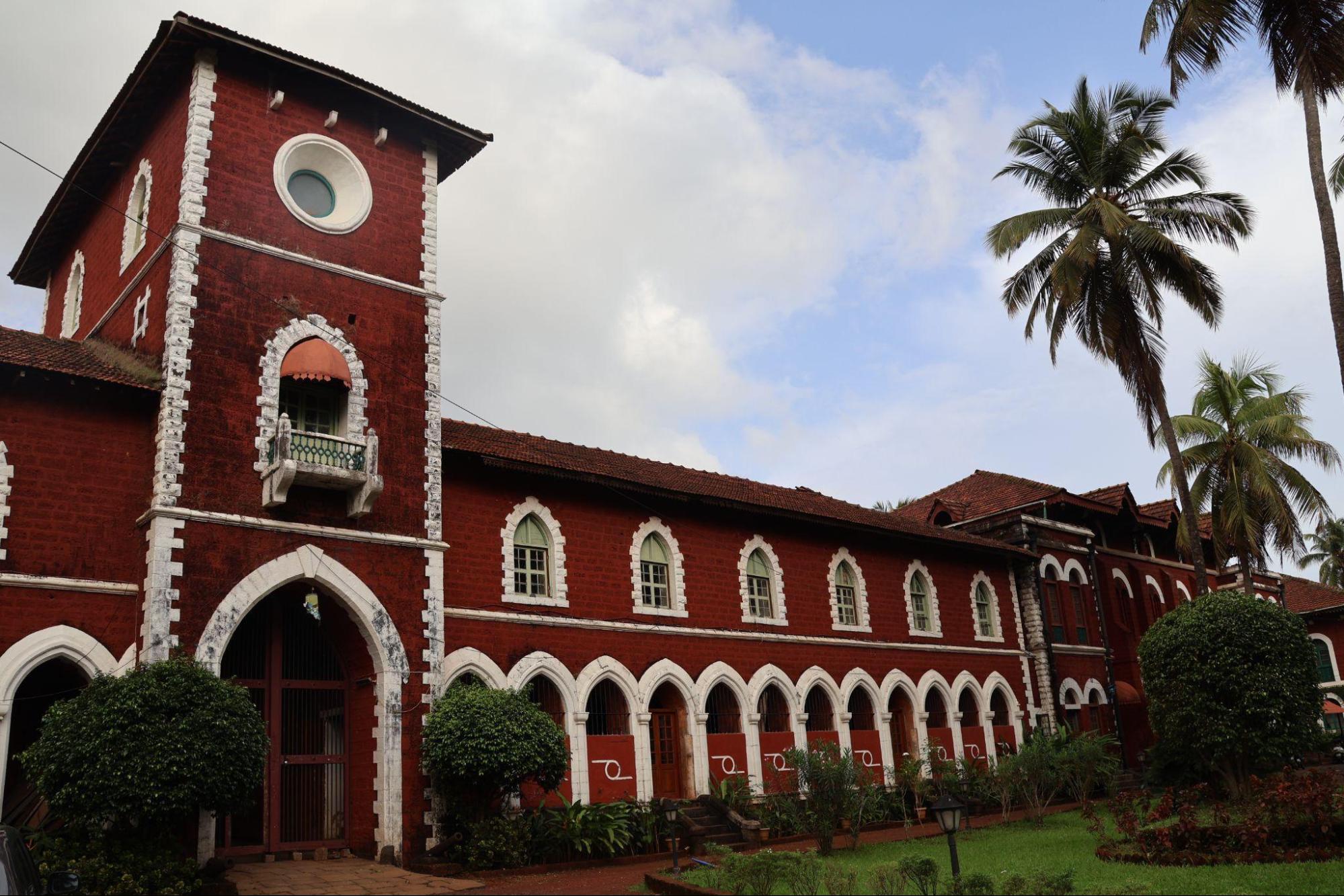The Sawantwadi Palace, framed by coconut groves and set against a backdrop of Narendra Hill. (Source: CKA Archives)