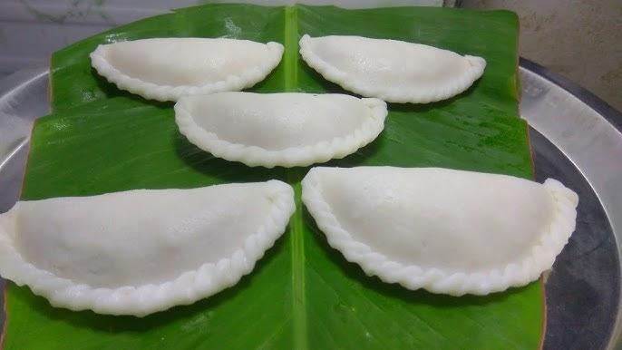 Steamed Nevarya filled with sweet coconut and jaggery saran, a festive delicacy of the region. (Source: CKA Archives)