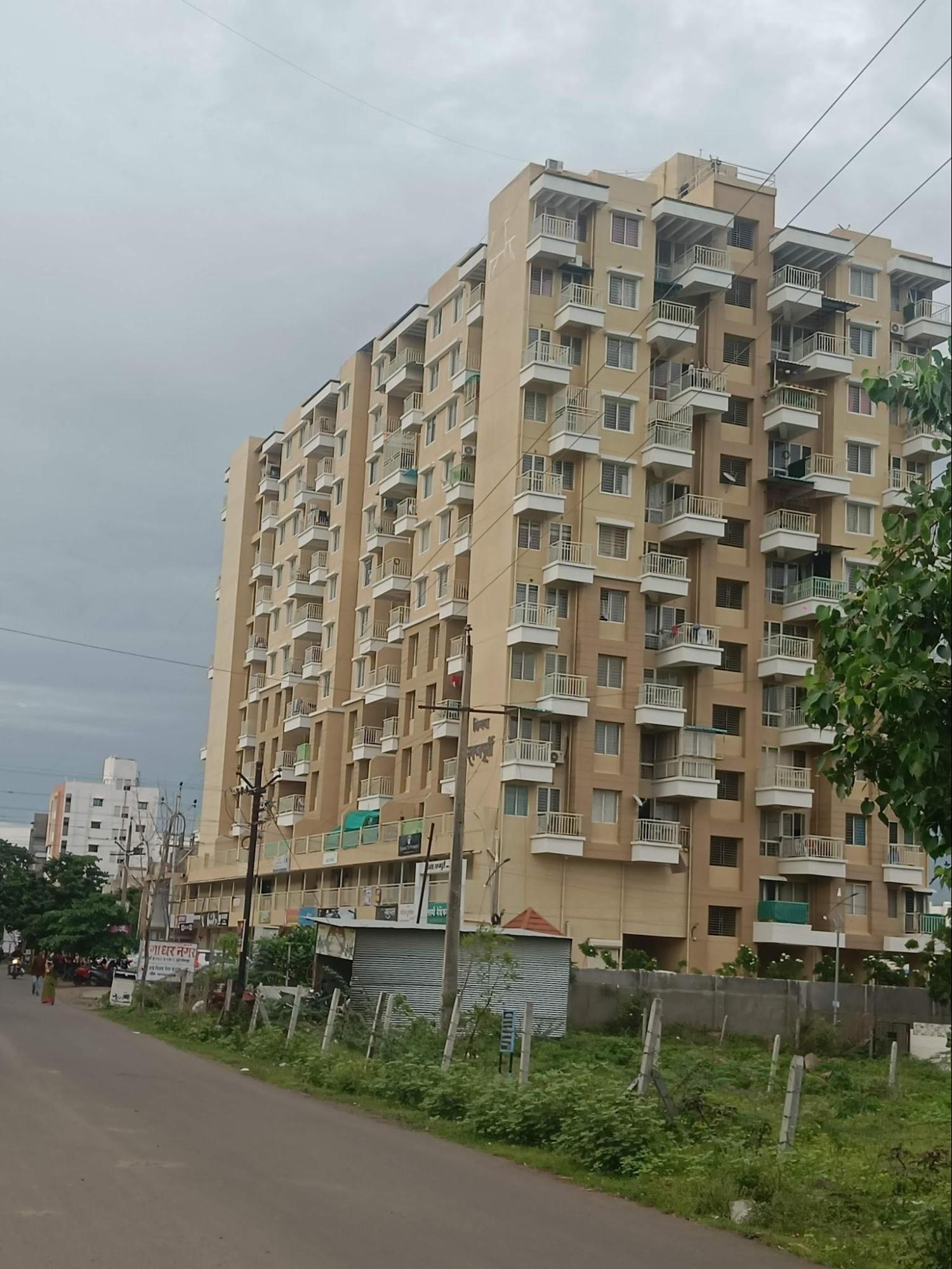 A neutral-toned residential building that serves as a prominent local landmark. (Source: CKA Archives)