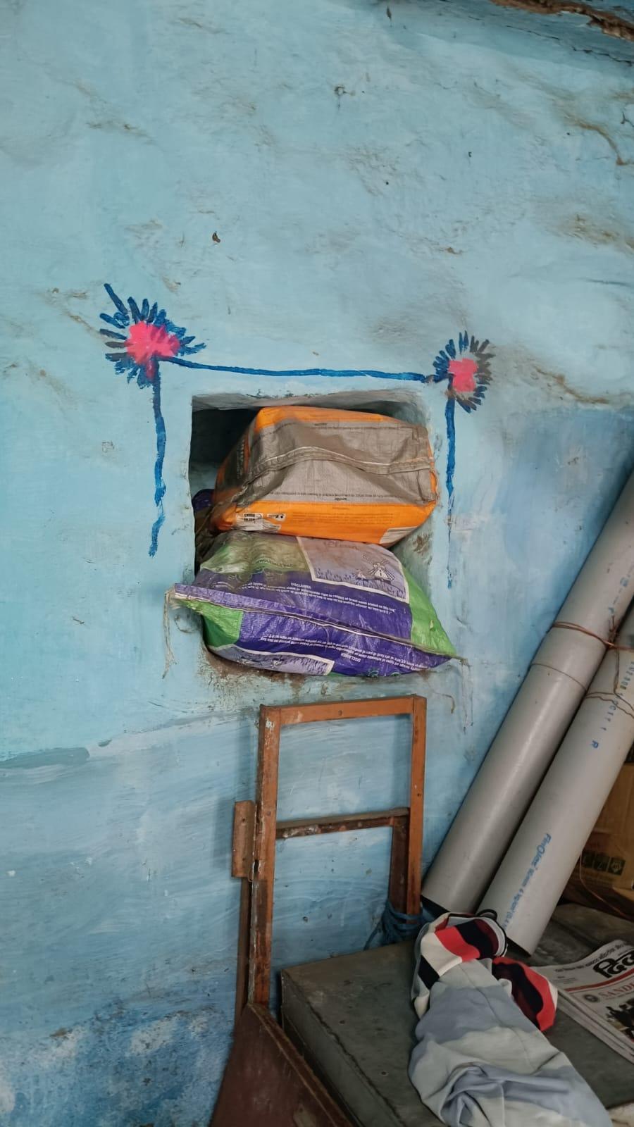 An open storage space used to store everyday items and decorated using floral murals on the wall. (Source: CKA Archives)