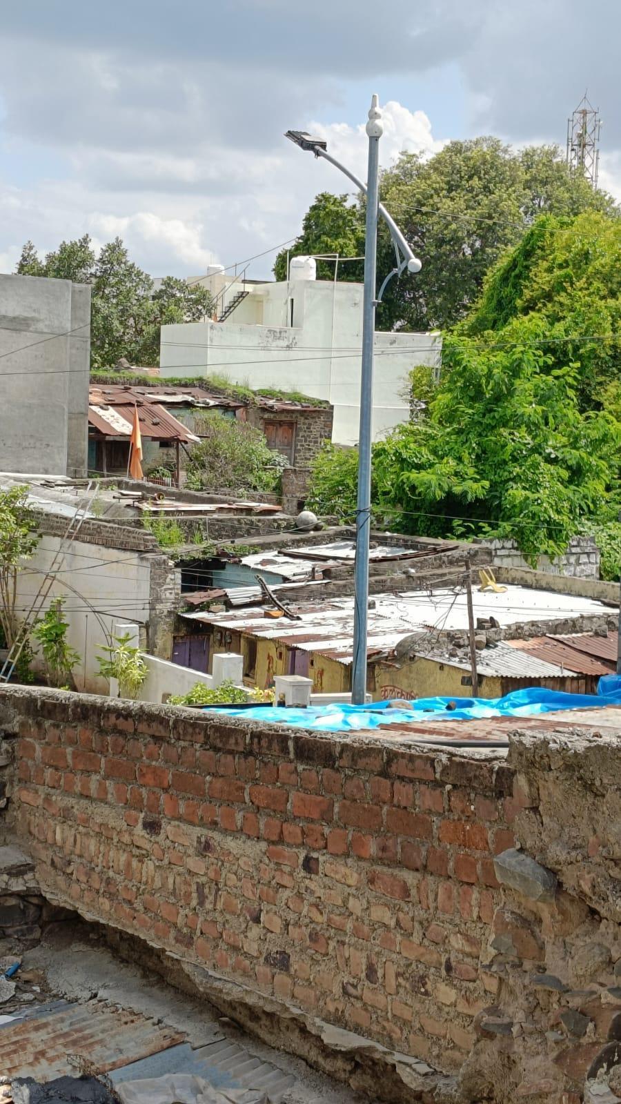 The house has a flat roof, with some sections covered by metal sheets and others by a wooden slab. (Source: CKA Archives)