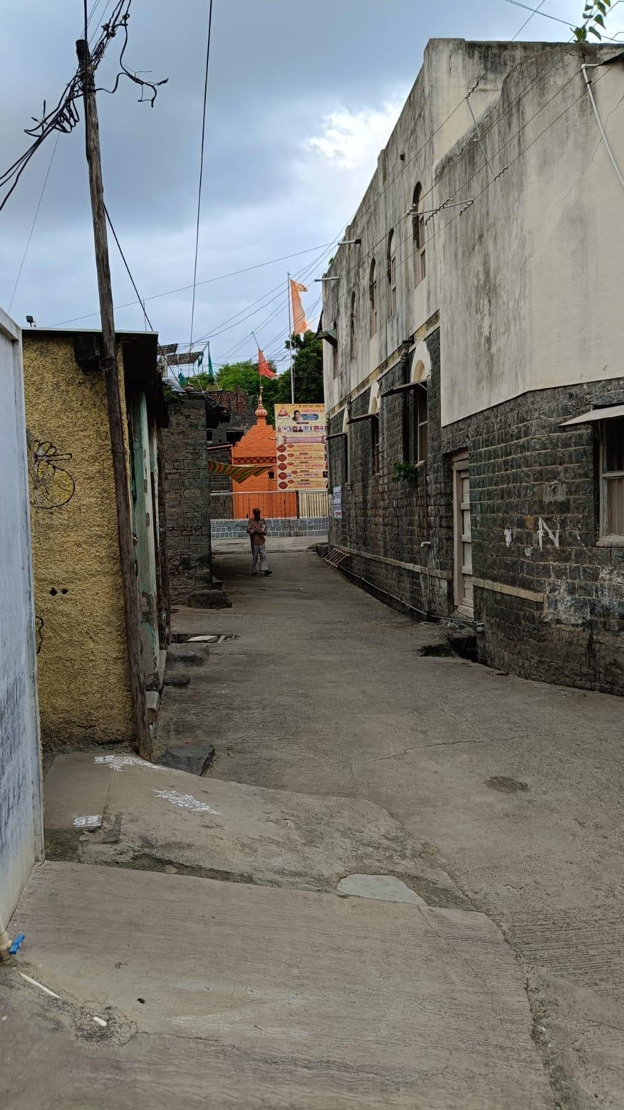 View of the Madhala Maruti Galli. Notice the Mandir at the entrance of the street. (Source: CKA Archives)