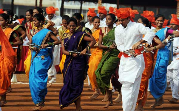 Lezim dancers in traditional attire showcasing synchronized steps and vibrant formations during a cultural event.[2]