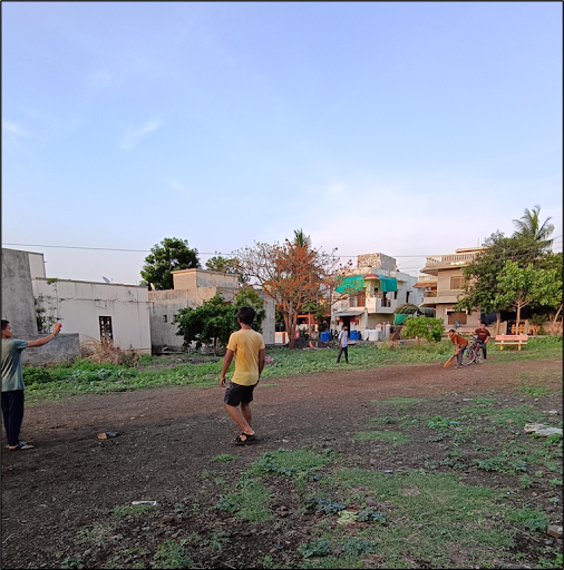 A few teens playing cricket on a weekend, in Samarth Nagar, Jeur Road, Akkalkot. Notice the use of a  bicycle as a stump. (Source: CKA Archives)