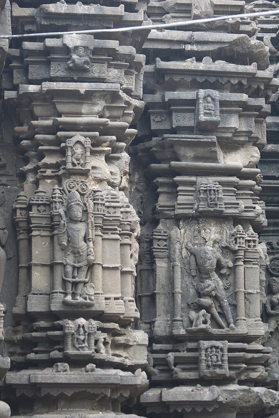 Intricate carvings and sculptures adorn the outer walls of Ambarnath Shiv Mandir.[2]