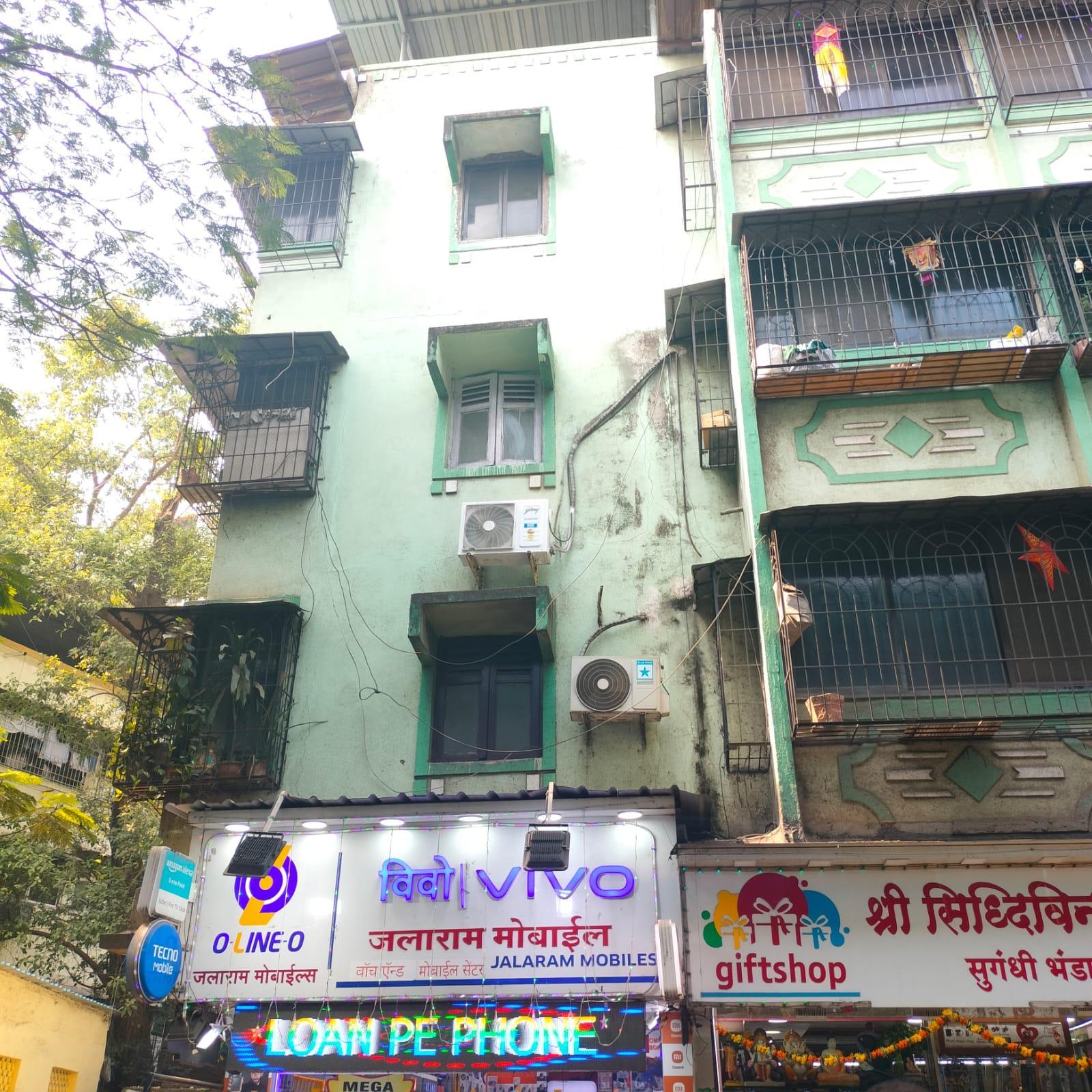 The windows, now enclosed with custom box grills, serve as semi-private indoor spaces, a common adaptation in buildings facing busy streets. It’s a practical design, in many ways, shaped by climate, culture, and the need to make space in a growing city. (Source: CKA Archives)