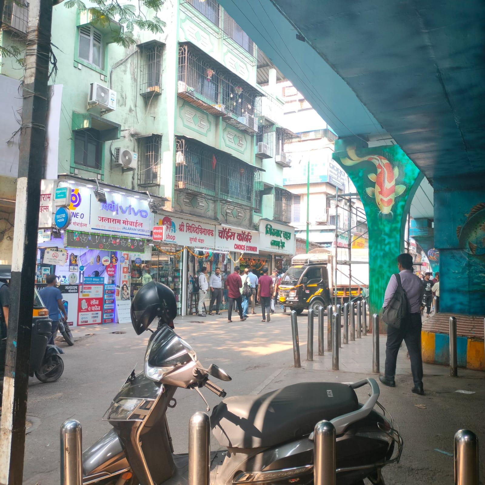 View of the residential building near Kopri Railway Bridge, with pastel green facade and street-facing commercial frontage. (Source: CKA Archives)