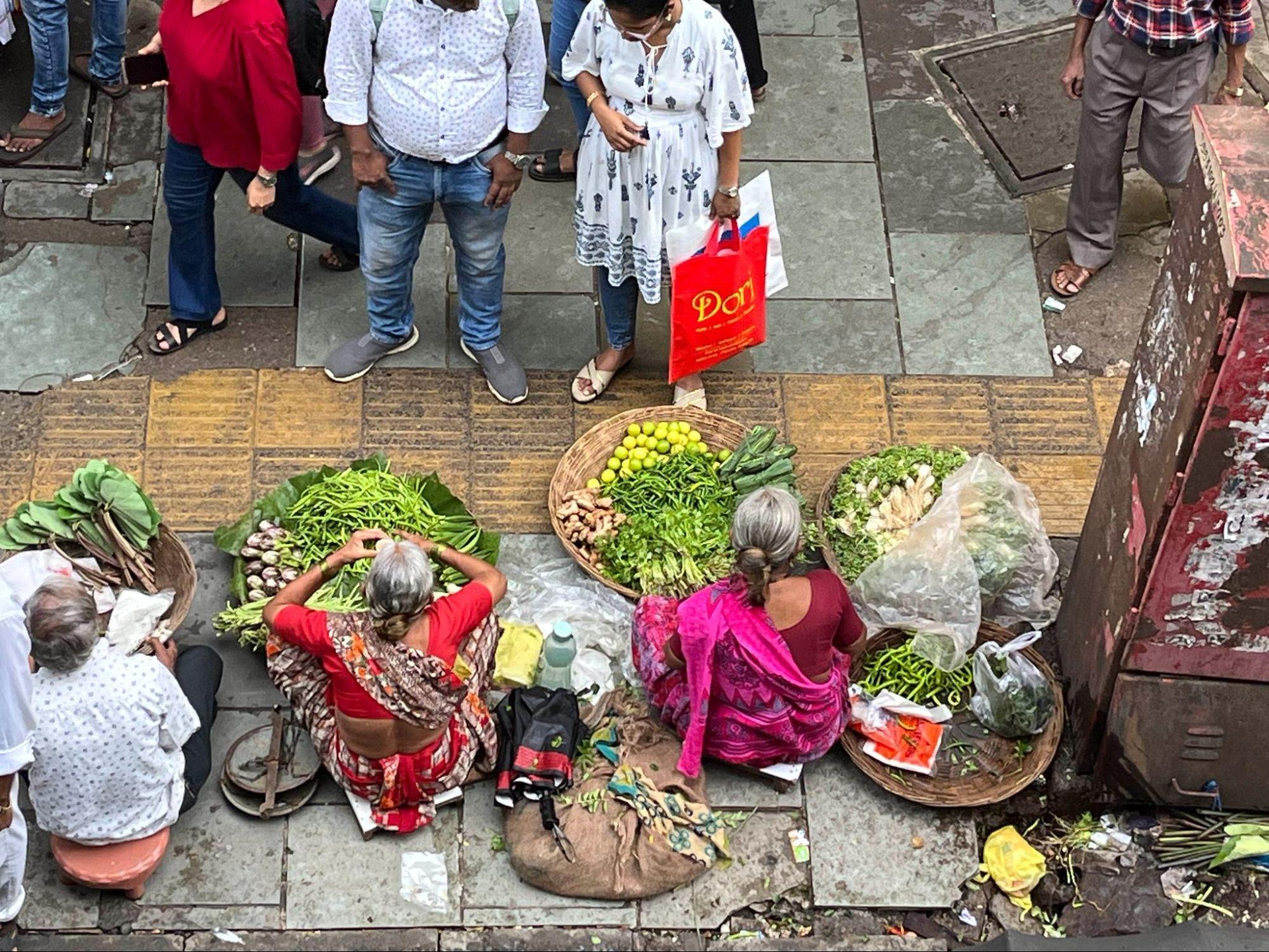 Women selling fresh vegetables at the market. (Source: CKA Archives)