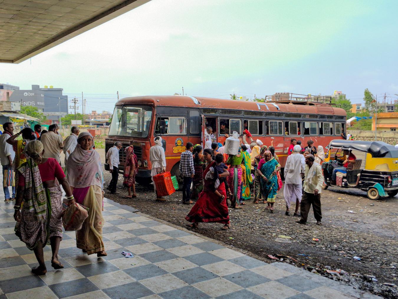Travelers boarding the Lal Pari bus before departure at the depot. (Source: CKA Archives)
