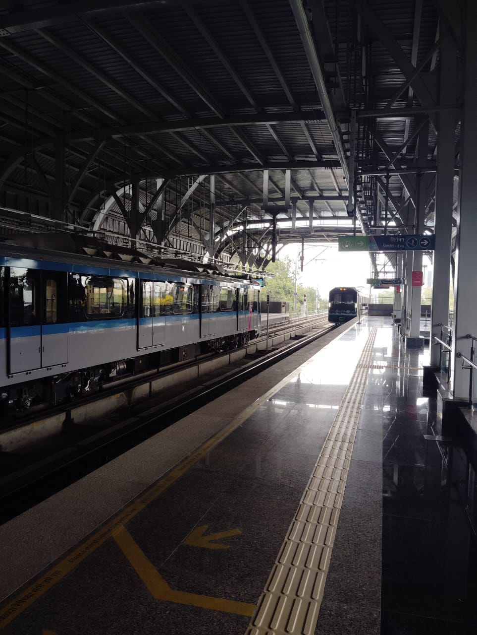 Train waiting at a Pune Metro platform, where digital access and clear signboards aid commuters. (Source: CKA Archives)